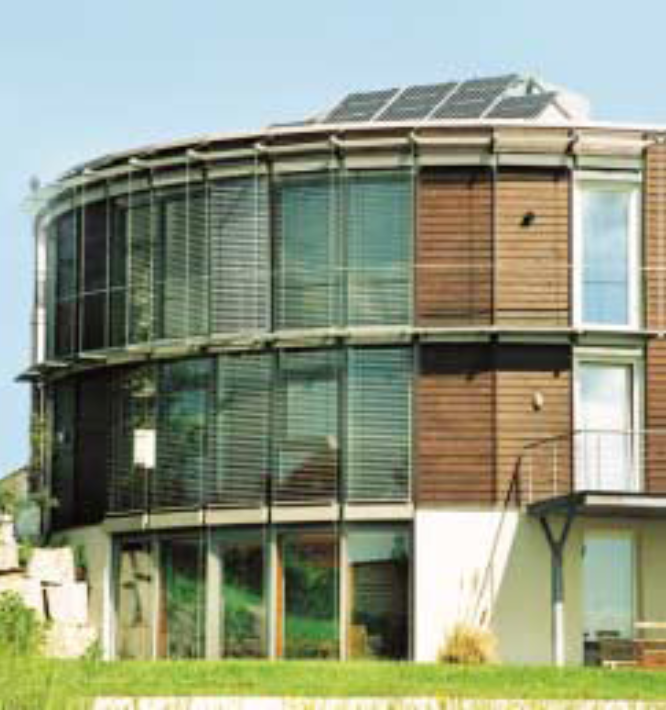 A building with a solar panel on the side AI-generated content may be incorrect.
