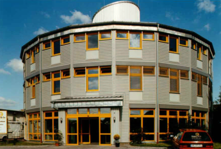 A building with yellow windows AI-generated content may be incorrect.