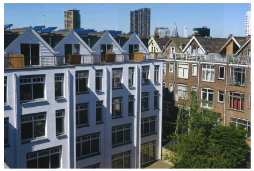 A group of buildings with trees in the background AI-generated content may be incorrect.