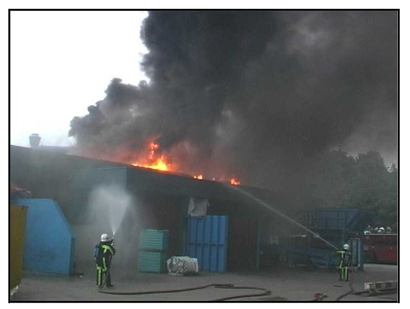 Firemen spraying water on a building AI-generated content may be incorrect.
